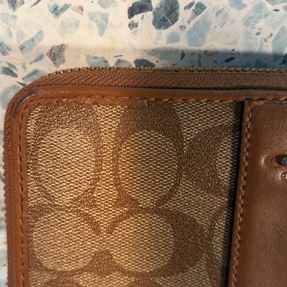 Coach Tan and Brown Signature Zip Wallet
PROJECT - Picture 7 of 9